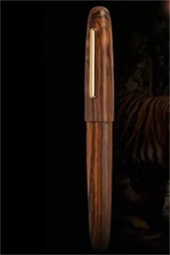 Wooden fountain pen with rotating cap shown in selected wood finish with chosen nib type.