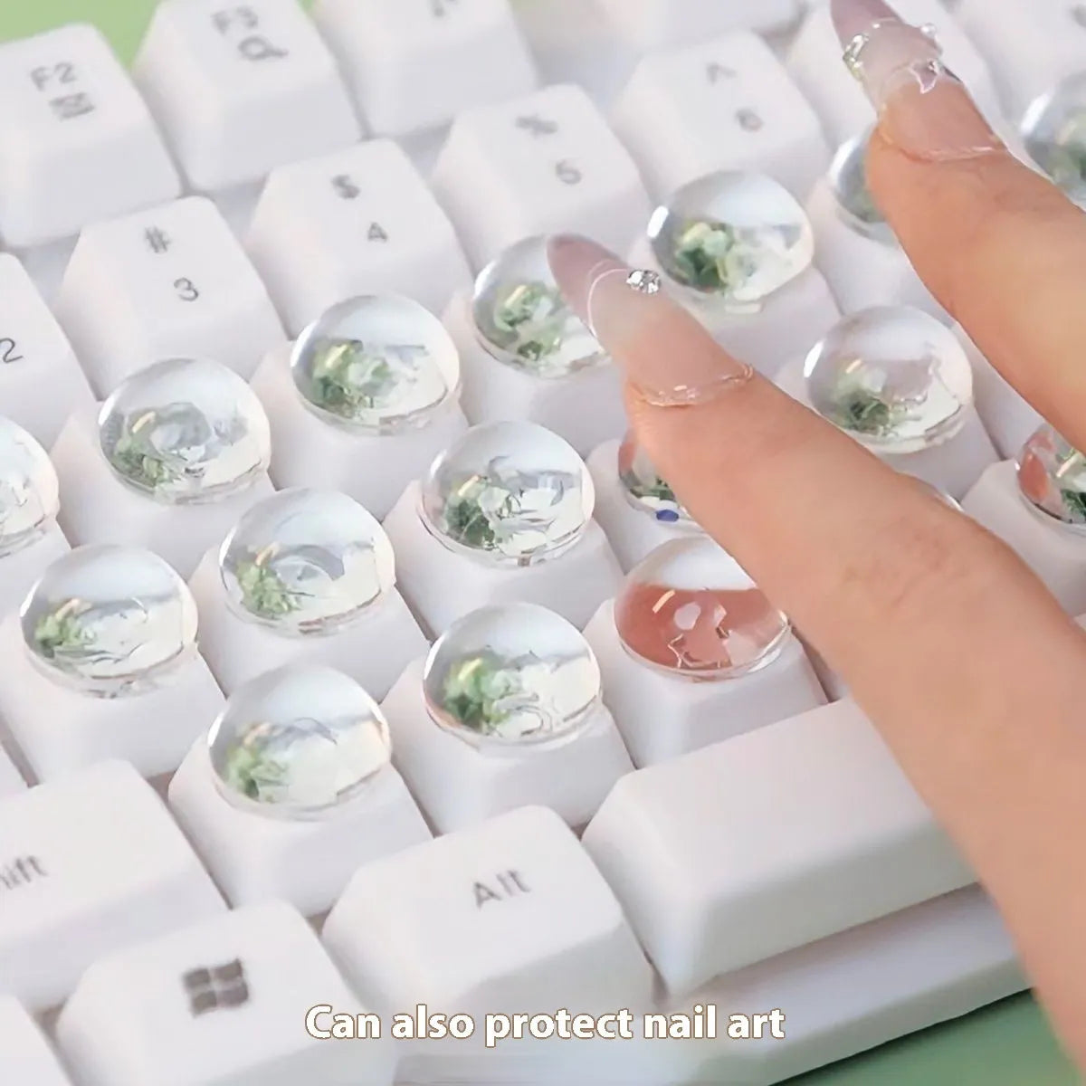 Set of PVC crystal glass ball keyboard stickers in 12x6mm size on a keyboard showing raised transparent domes