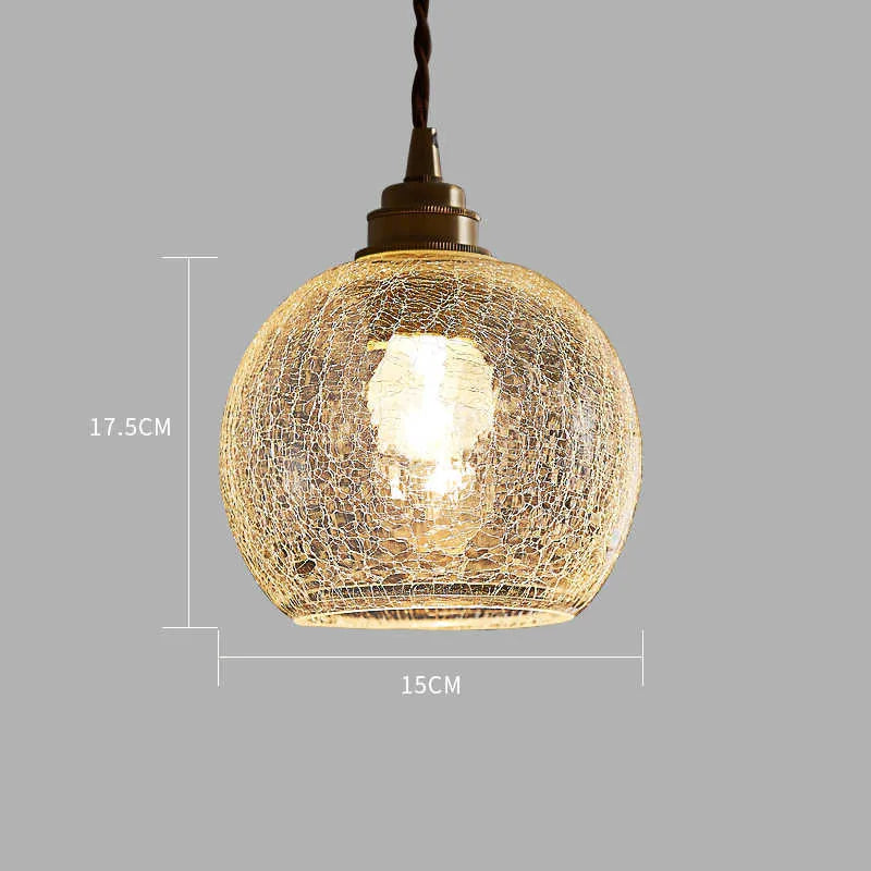 Retro brass and glass ball chandelier ceiling light with copper frame and spherical shade.