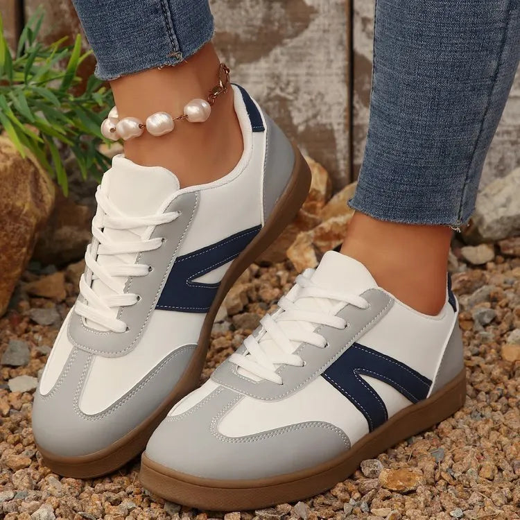 Blue women's low-top hiking training shoes with a lace-up front and rubber sole.