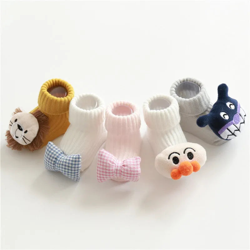 Cotton baby floor socks in blue bow pattern for infants 0-3 months.