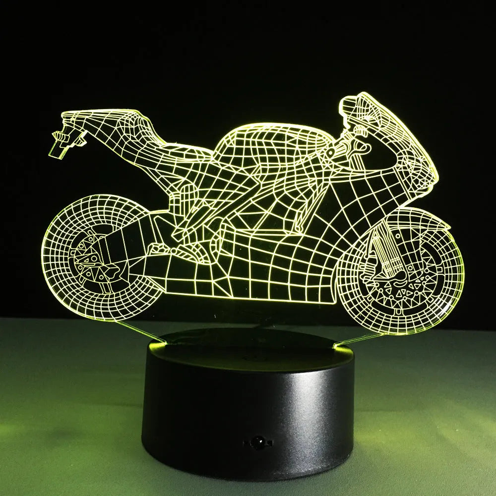 Motorcycle LED desk lamp with black base and acrylic shade on a wooden desk, 220x130x90mm