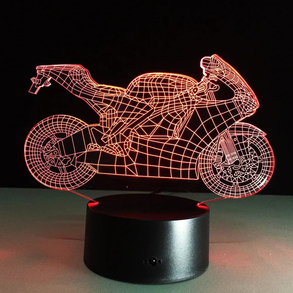 Motorcycle LED desk lamp with black base and acrylic shade on a wooden desk, 220x130x90mm