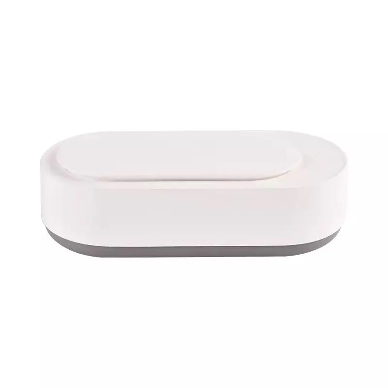 White portable ultrasonic cleaning machine with stainless steel tank for jewellery and glasses.