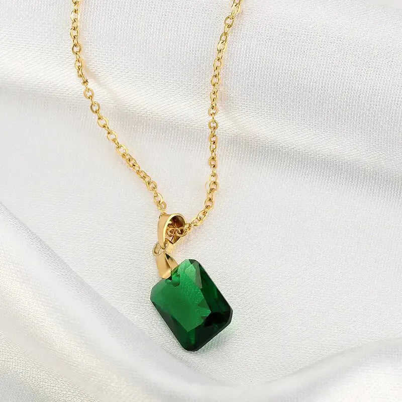 Copper necklace with green rectangular geometric quadrilateral pendant on O-ring chain.