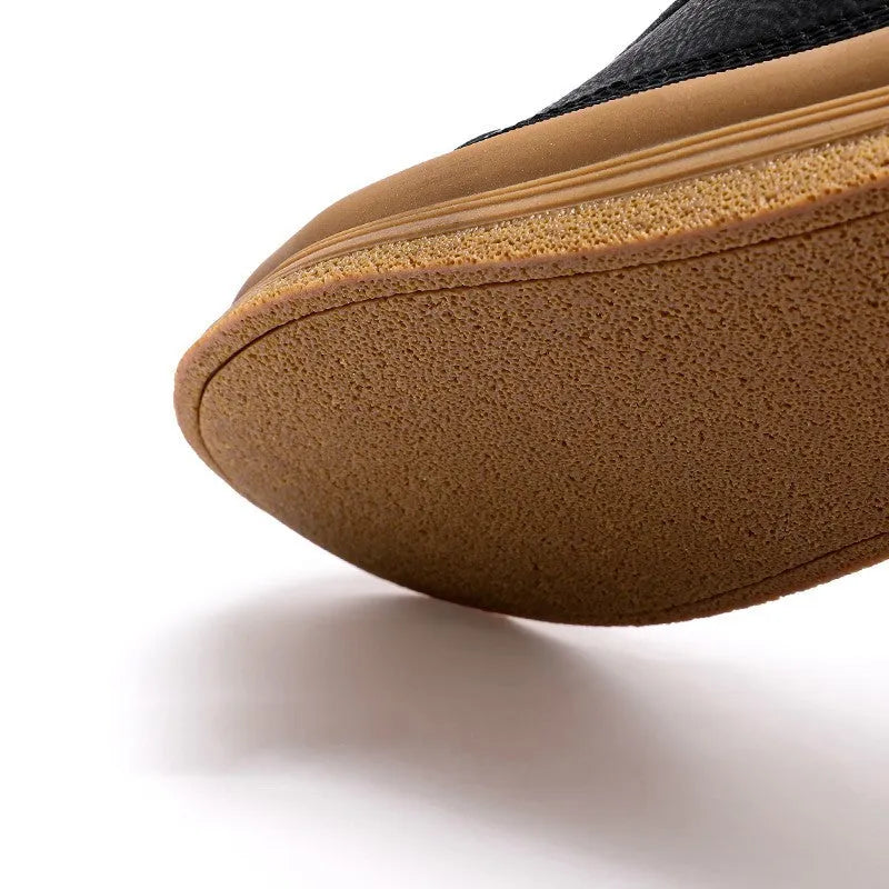 Men's black leather lace-up casual shoes with a round toe and flat rubber sole on a white background.