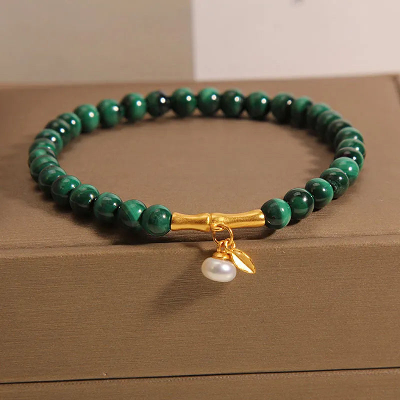 White crystal lucky bamboo bracelet for women, showing high-rise design on wrist.