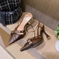 Women's mid heel patent leather pointed toe buckle sandals in Black and Caramel with cross strap
