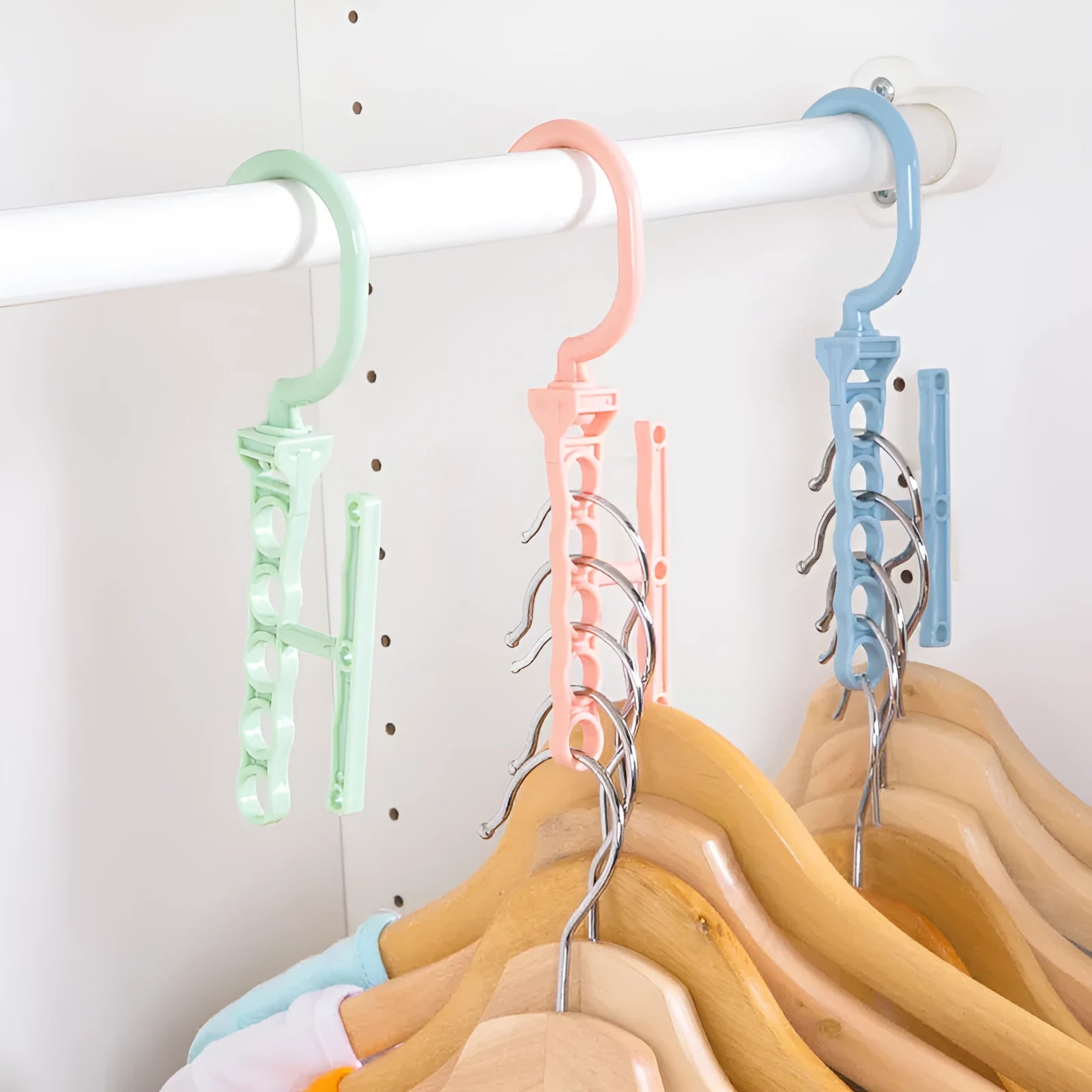 Blue revolving magic wardrobe hanger with five branches and a central carry handle.