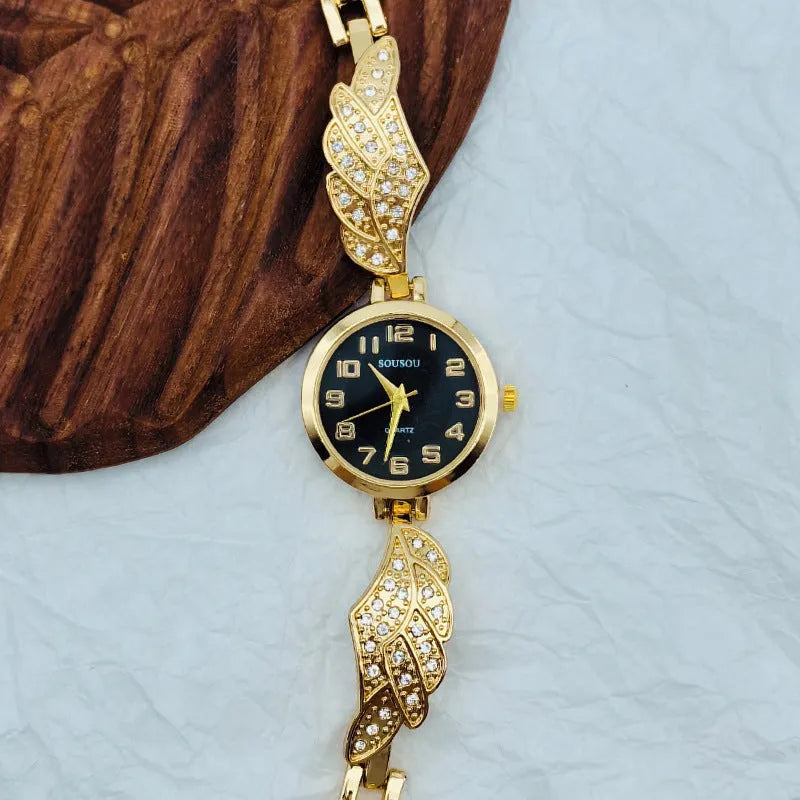 Women's stainless steel watch with round dial in gold, black gold, or white gold finish.