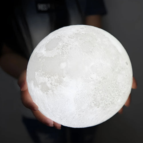 3D printed moon lamp with lunar surface detail on wooden stand, showing touch metal ring at base