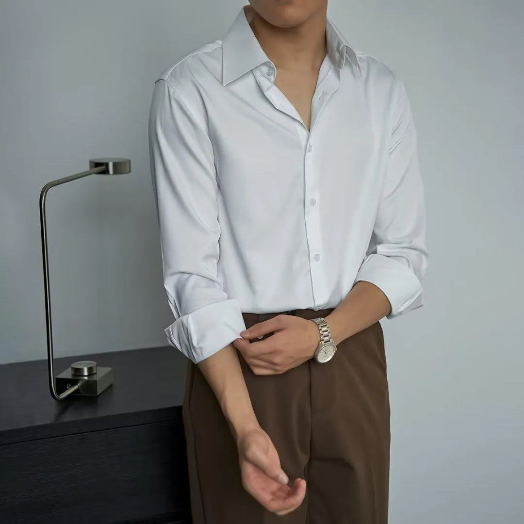 Man wearing a black Japanese retro style loose-fit long sleeve cardigan shirt.