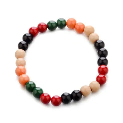 A natural stone bead bracelet with lava stone beads on a wrist, showing its ethnic style and approximately 18cm length.