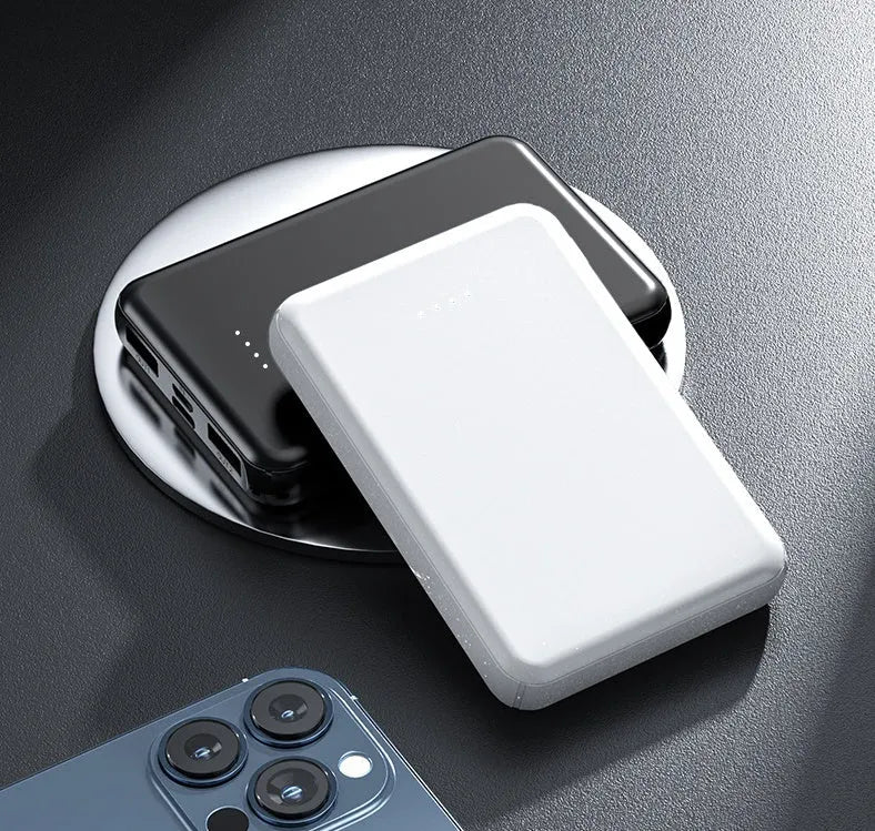 Black and white electric heating vest power bank with USB port showing compact size.