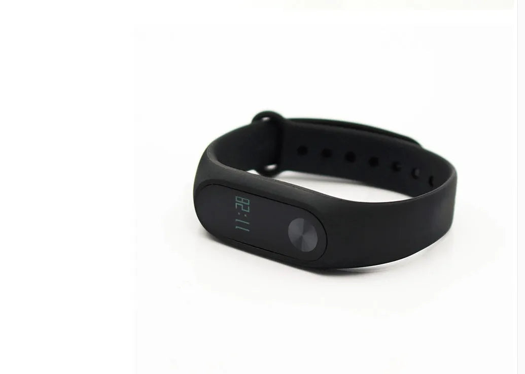 Xiaomi Mi Band 2 black fitness tracker with OLED display showing heart rate reading