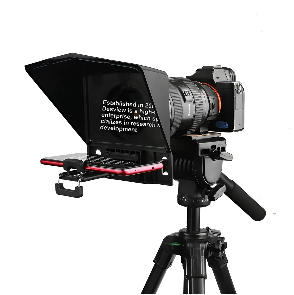 Portable small black cell phone teleprompter with adapter rings and remote control on a table