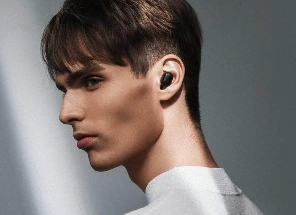 Redmi AirDots True Wireless black earbuds and charging case with three earplug sizes.