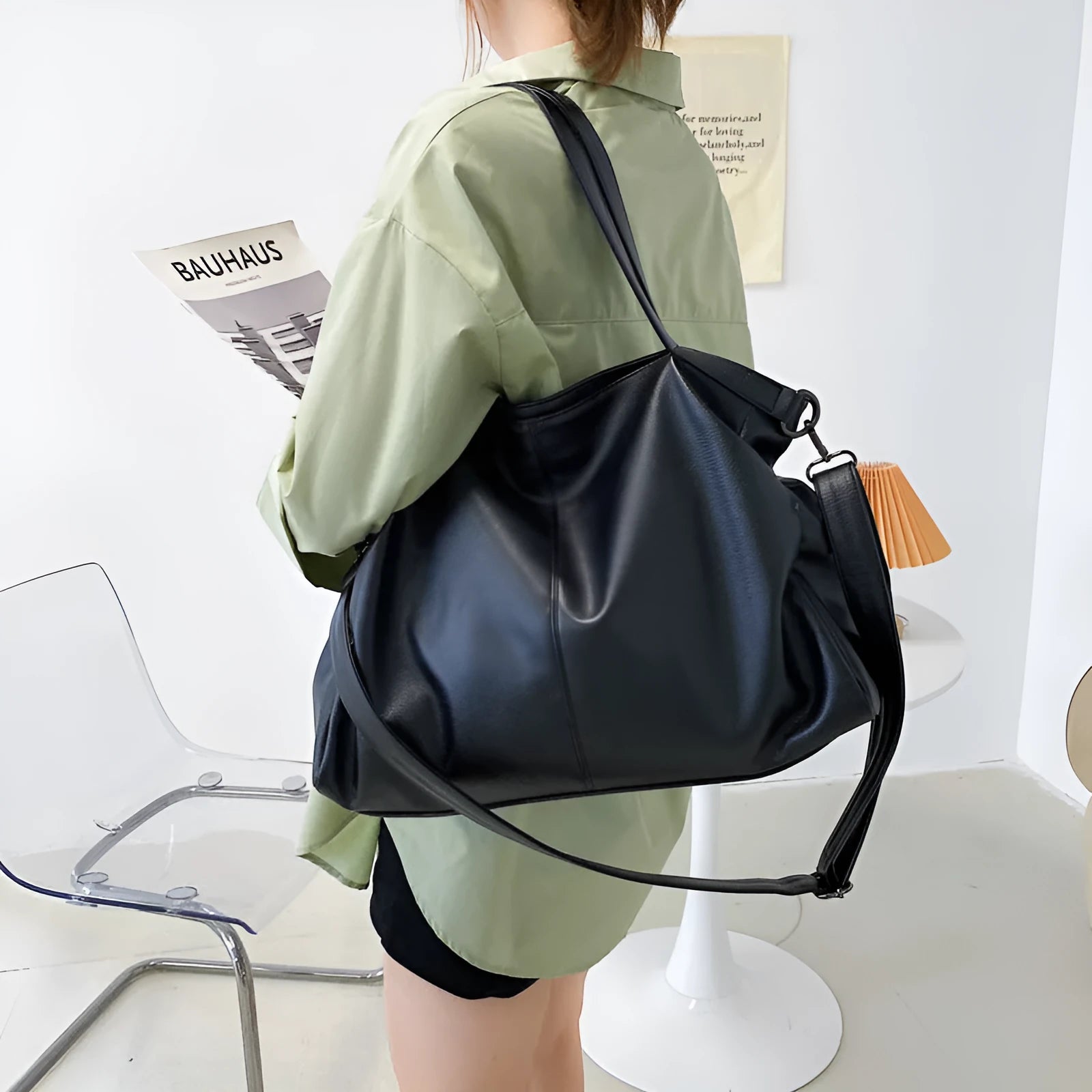 Large soft surface messenger bag in horizontal square shape with adjustable shoulder strap