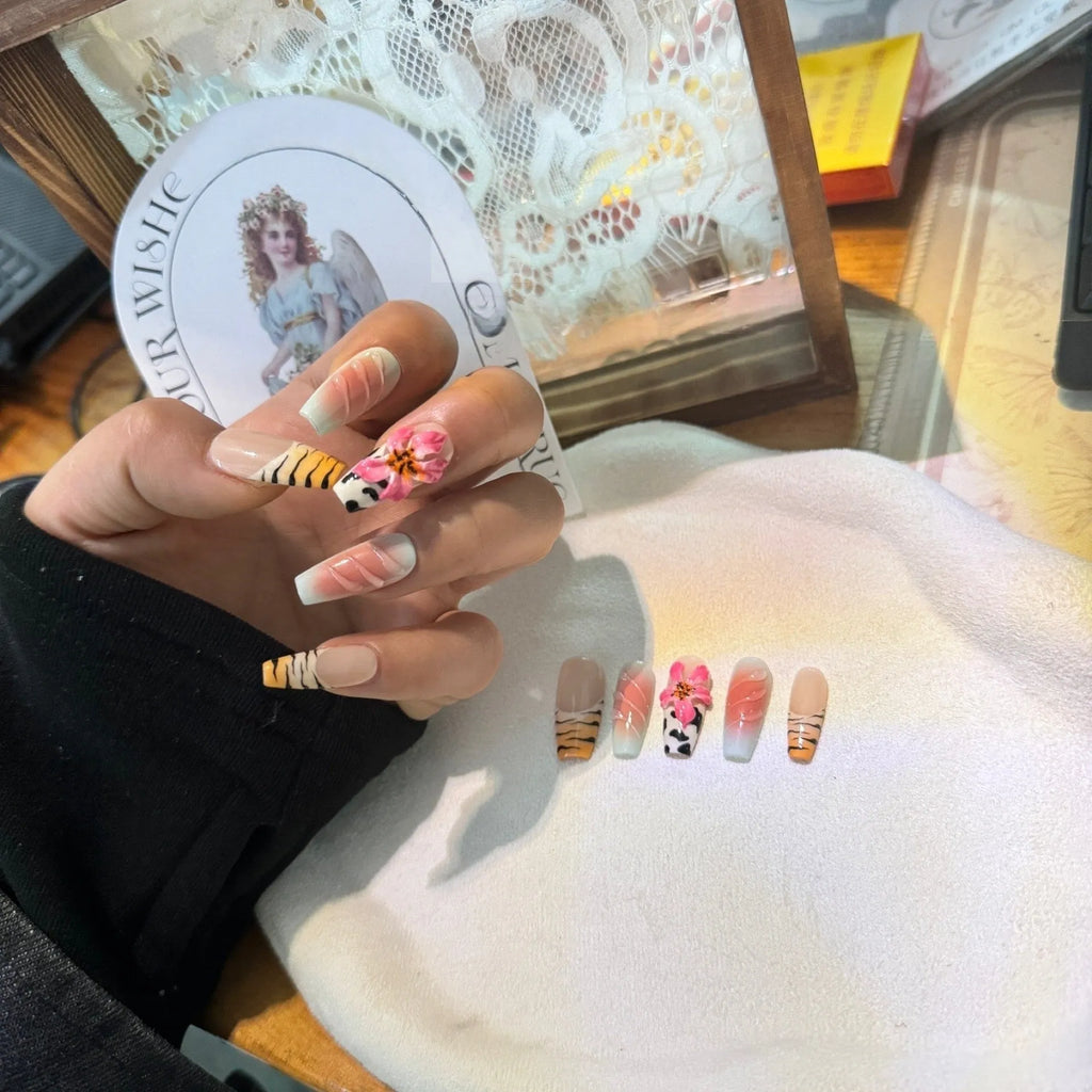 Lily and zebra pattern hand-carved press-on nail art set in a long, wear-resistant style.