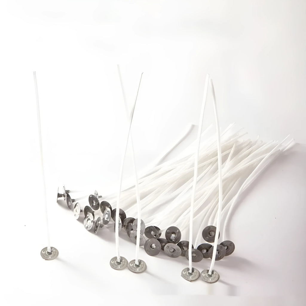 White cotton candle wicks showing tightly woven construction in three different lengths