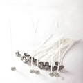 White cotton candle wicks showing tightly woven construction in three different lengths