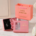 Korean-style gift box open to show six red rose-shaped soap flowers with gift handbag.