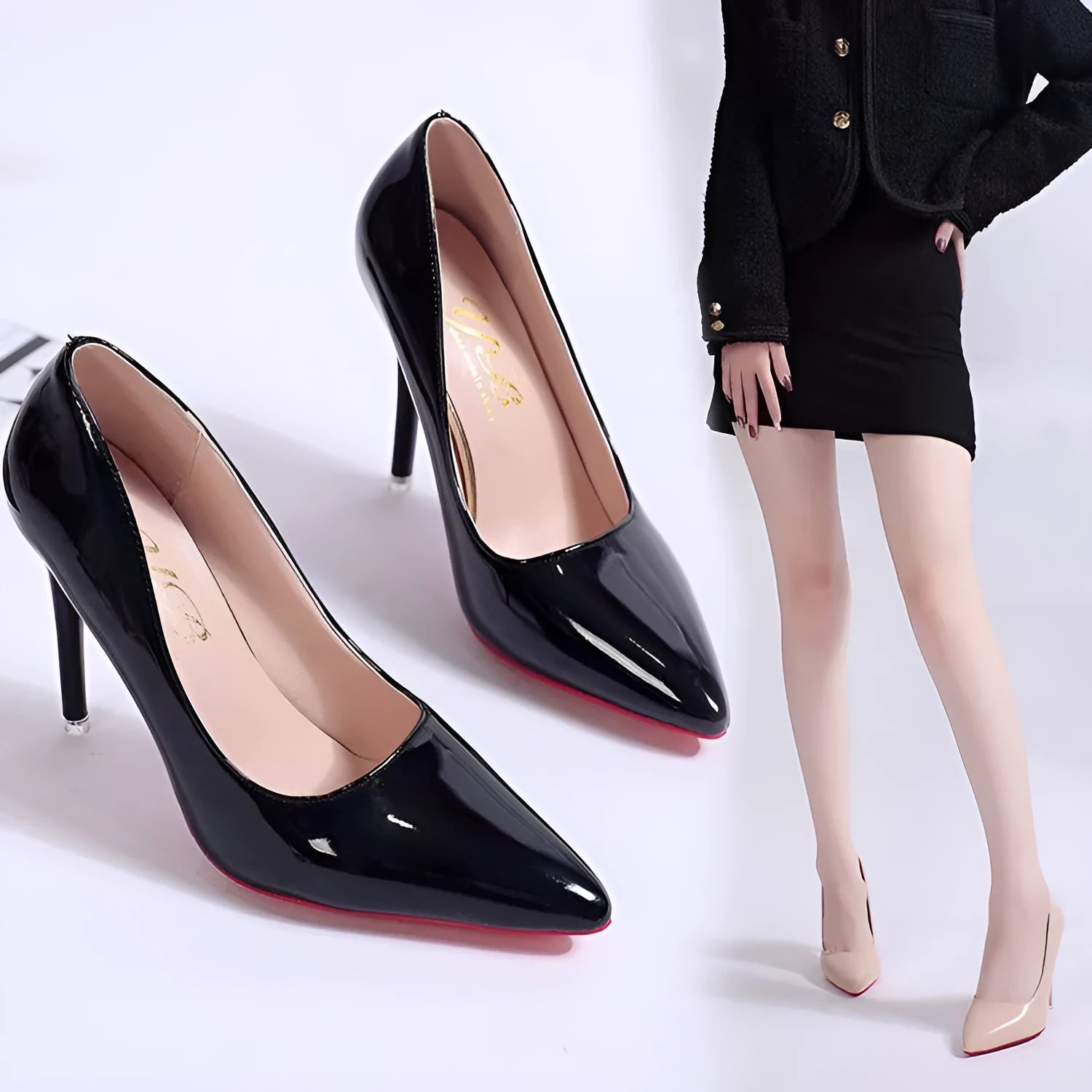 Women's black PU stiletto heel pump shoes with pointed toe and shallow mouth cutout design on white background