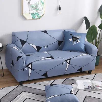 Geometric patterned stretch sofa slipcover fitted on a three-seater sofa in a living room.