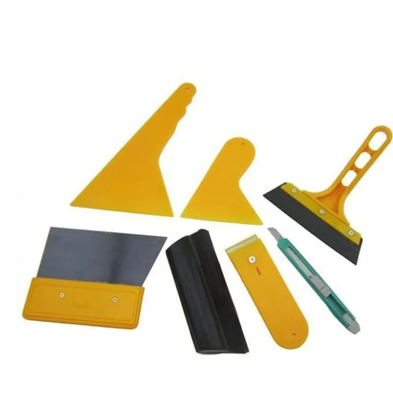 Seven-piece car film tool set with scrapers, knives, and a pressing block for window tinting and screen protector application.