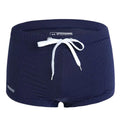 Men's solid colour nylon boxer swimming trunks with a low waist design on a white background.