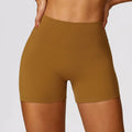 Women's high waist nylon yoga shorts in basil green colour on a mannequin.