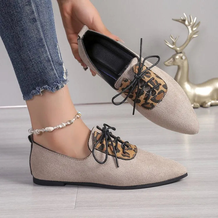 Beige leopard print pointed toe pumps for women in plus sizes, shown on a white background.