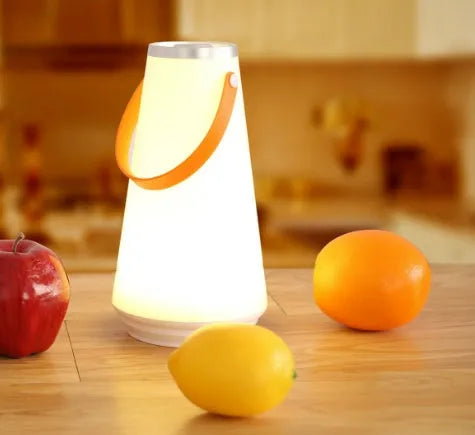 White rechargeable LED bedside night light with touch controls showing compact 12cm square design