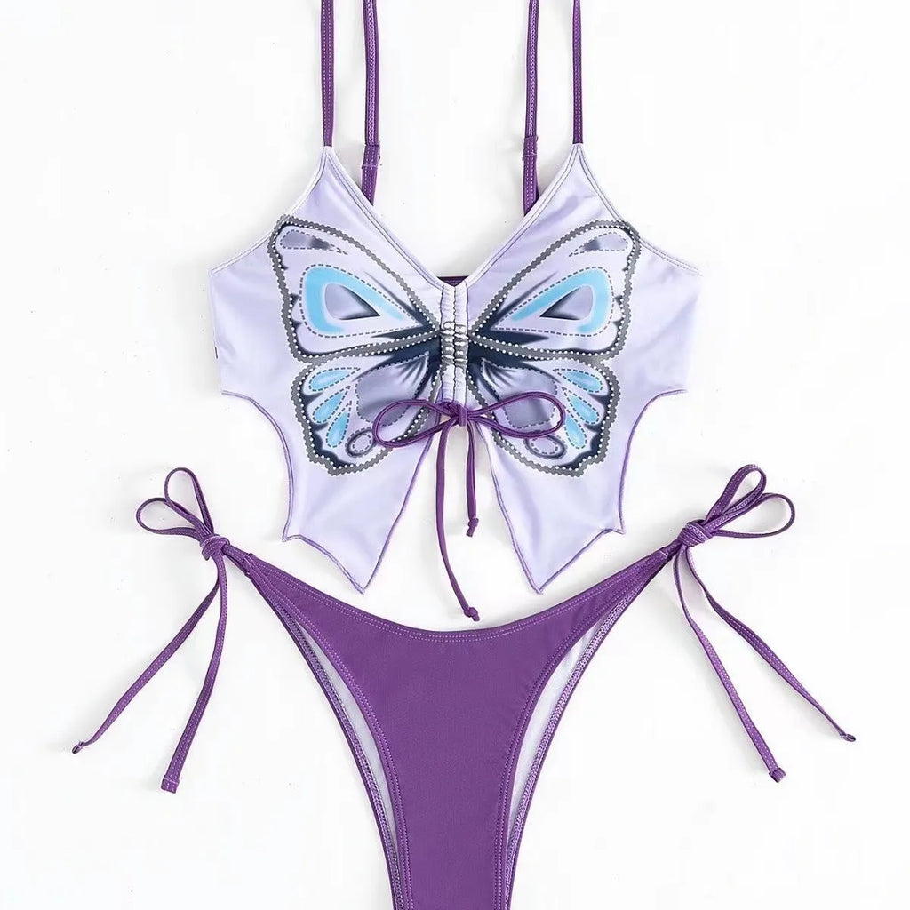 Purple women's bikini suit with bow detail and split design on a mannequin.