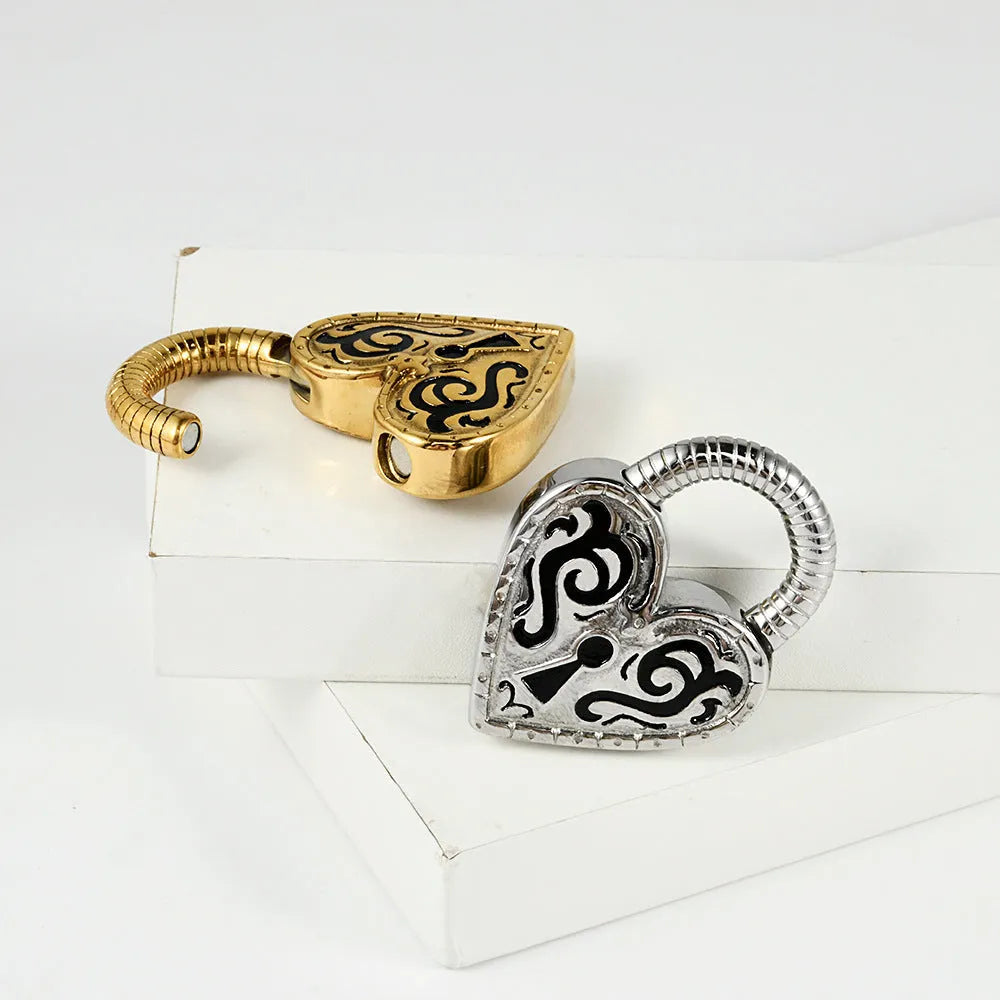 Close-up of a women's stainless steel heart-shaped earring for piercings, shown in gold and steel colour options.