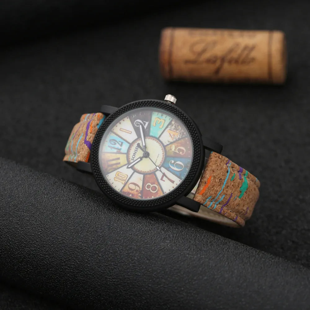 Women's vintage-style quartz watch with brown leather strap and round silver dial