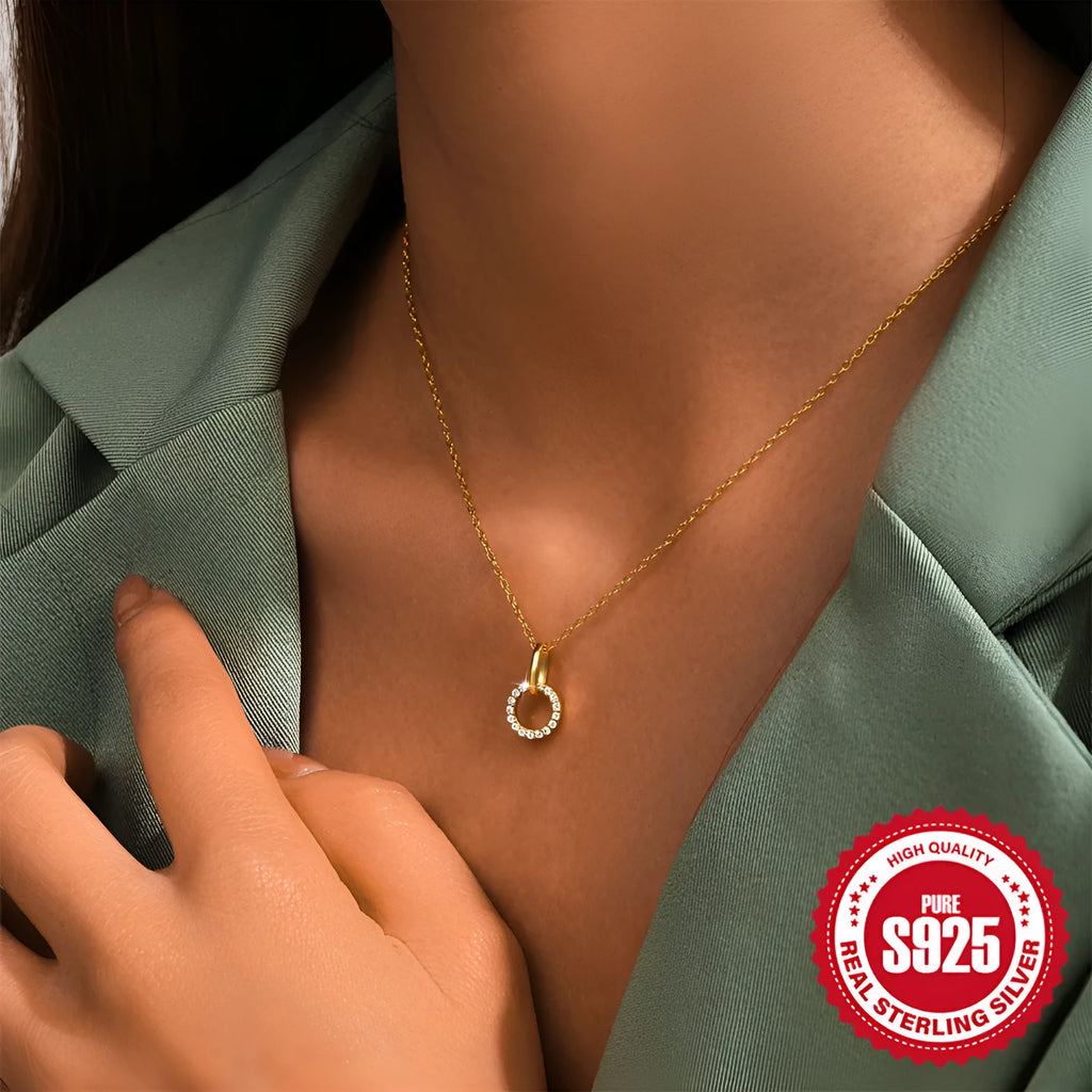 Gold-coloured S925 sterling silver geometric pendant necklace on a model, showing adjustable clasp.