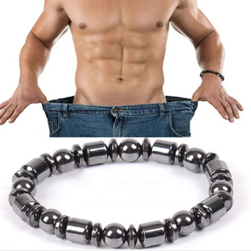 Black pentagram stone magnetic therapy bracelet with stretch fit on a wrist.