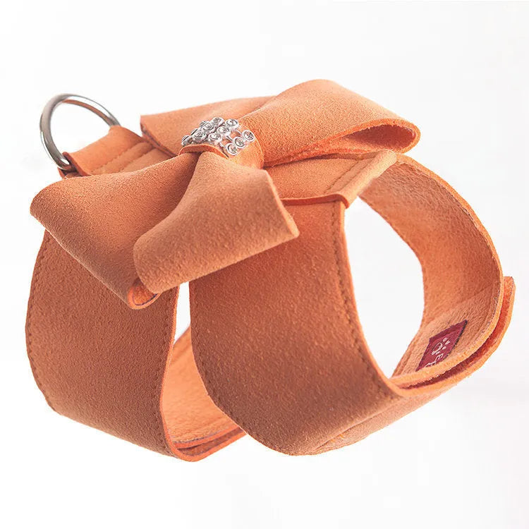 Cute pink microfiber dog chest strap harness with a large bowknot decoration and a metal D-ring.