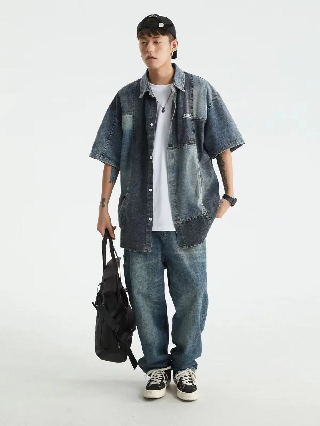Blue men's loose-fit denim shirt with Japanese retro wash and stitching details, shown open as a cardigan.