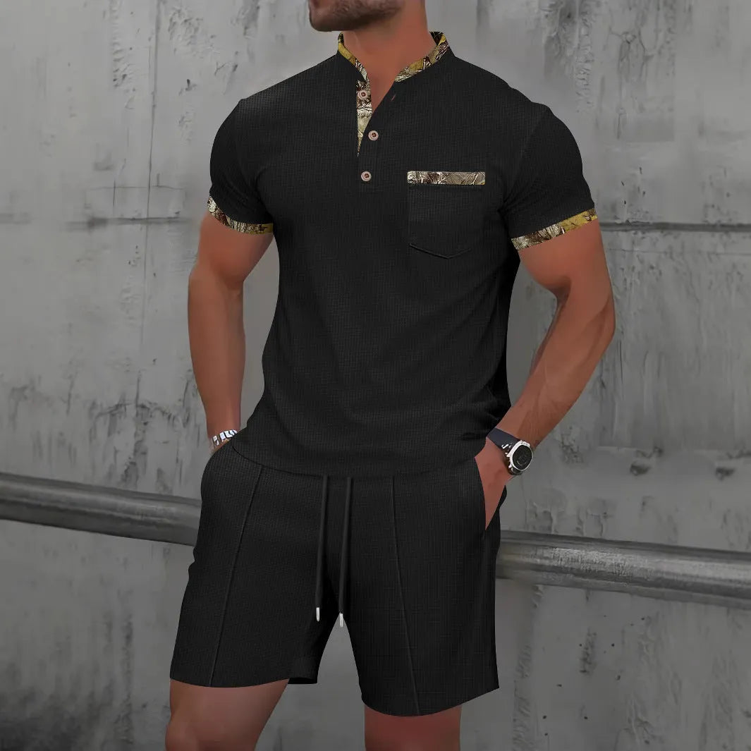 Men's grey short sleeve zip-up polo collar top and matching shorts laid flat.