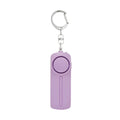 Compact pink self-defense alarm with keychain showing dimensions 86mm x 30mm x 20mm