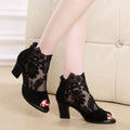 Black lace gladiator sandals with square high heel, peep toe and front zip closure