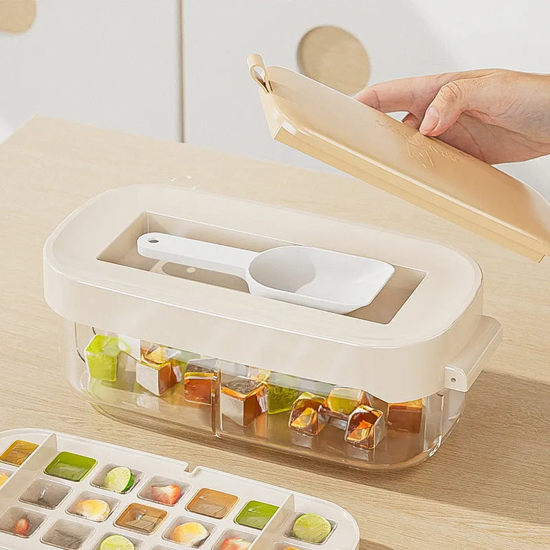 Blue high capacity ice cube tray with integrated storage for an ice shovel, showing the grid layout.