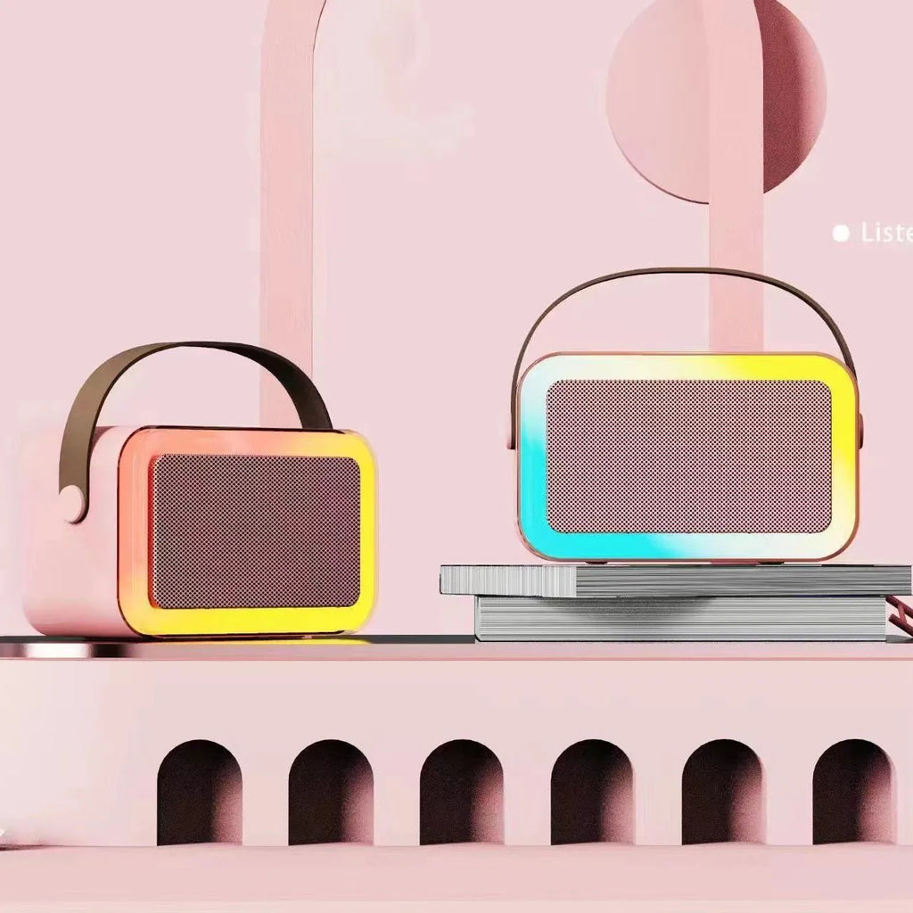 Portable Bluetooth karaoke speaker in white, pink, or sky blue colour with microphone function