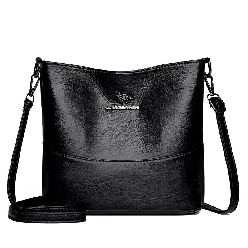 Women's black bucket-style leather shoulder bag with sewing line detailing and shoulder strap