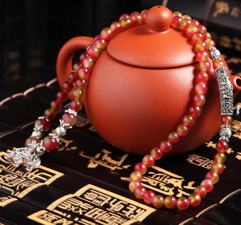 Natural watermelon crystal bracelet with Chinese knot design in 6mm and 8mm size options