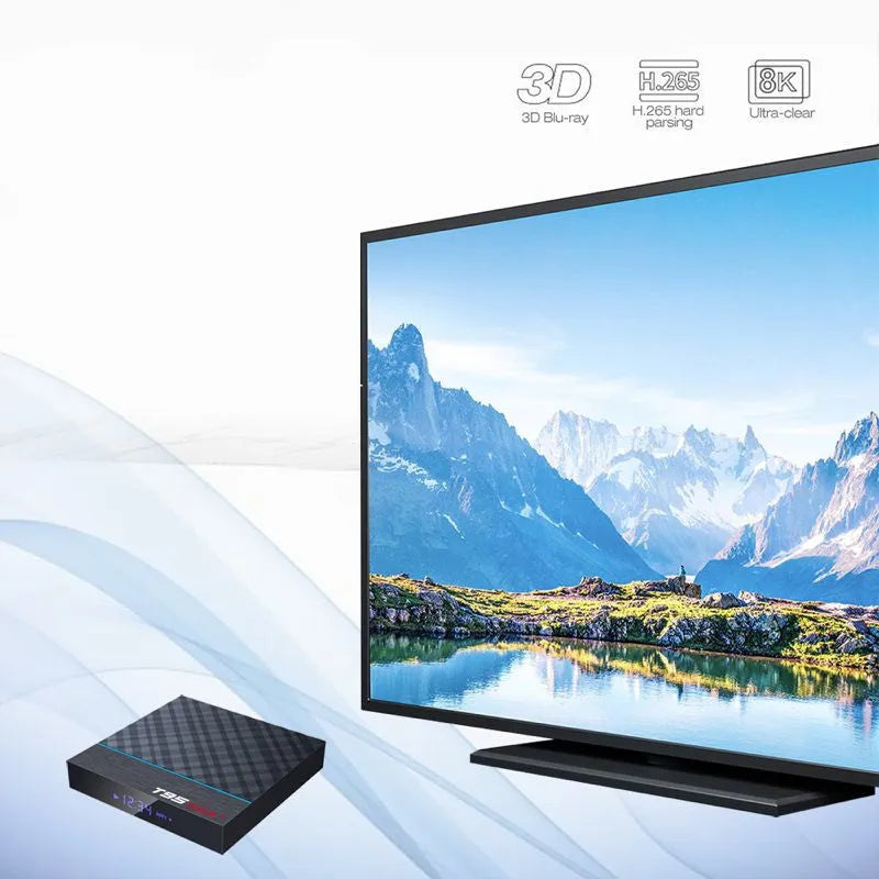 Black T95 Max Plus Android TV box unit with remote control and UK power plug adapter on a table.