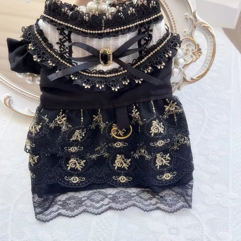 Golden gothic-style skirt costume for a small dog or cat on a mannequin.