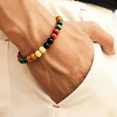 A natural stone bead bracelet with lava stone beads on a wrist, showing its ethnic style and approximately 18cm length.